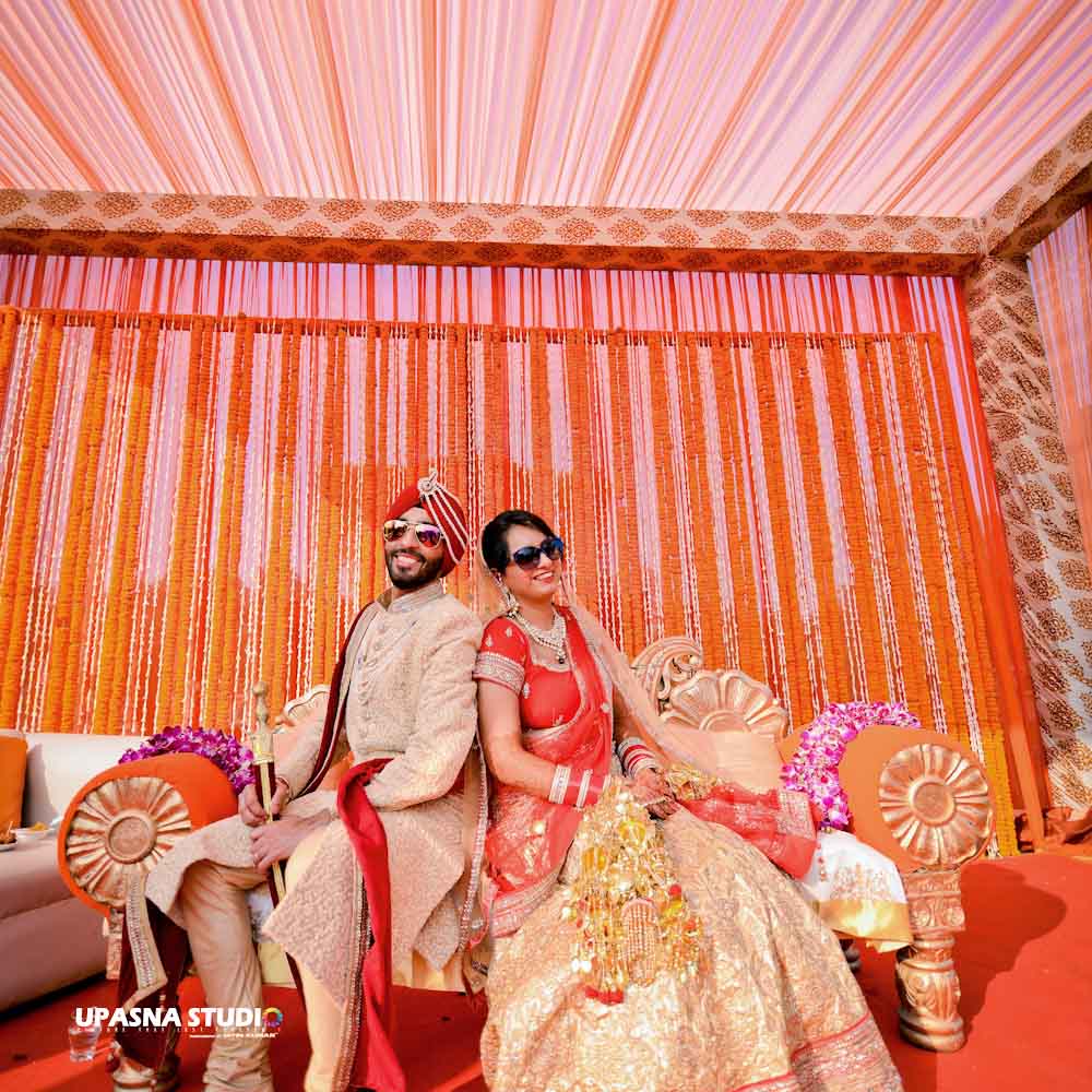 punjabi couple pose in wedding